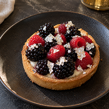 Berry tart scattered with silver flake