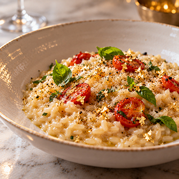 Risotto finished with edible gold leaf