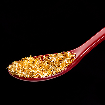 Gold dust piled on a spoon